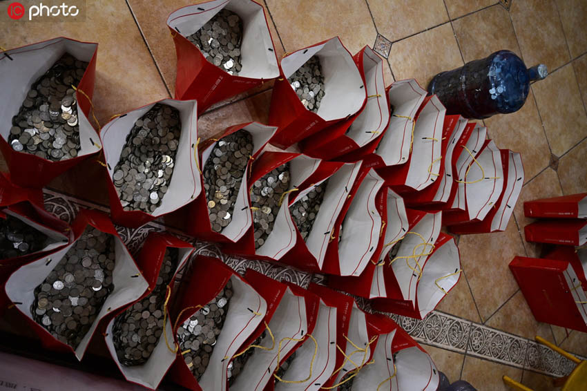 山東省の男性がマンションの頭金を硬貨で一括払い　10人がかりで4時(shí)間かけて數(shù)える