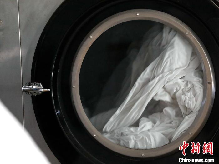 春運スタート　寢臺列車の寢具はどうやって洗い、消毒するのか？