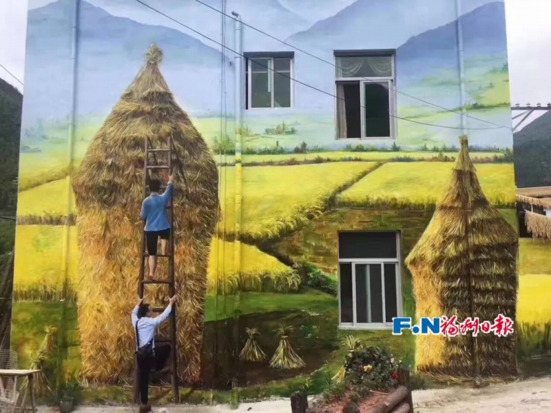 農(nóng)村でウォールアートを制作する林小燕さんのチーム。